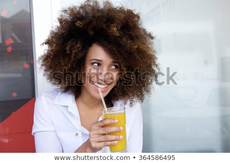 Stock fotó: Woman Drinking An Orange With Straw