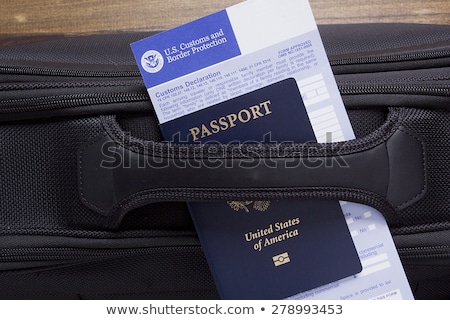 [[stock_photo]]: Customs Declaration On A Road Suitcase