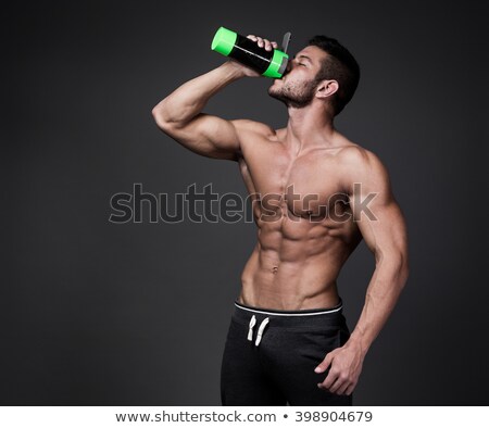 Сток-фото: Man Bodybuilder Is Holding A Shaker For Drinks
