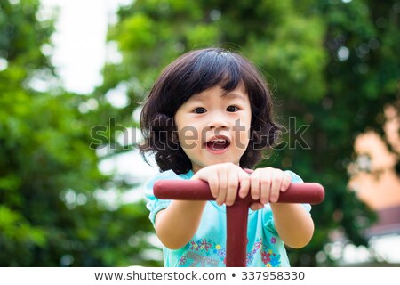 Сток-фото: Portrait Of A Little Asian Girl In Swing