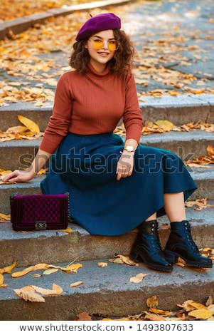 Stock photo: Portrait Of A Cheerful Young Woman Wearing Beret