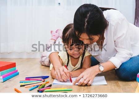 Stockfoto: Mother And Daughters Drawing Together