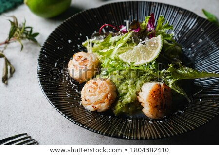 Zdjęcia stock: Close Up Of Fish Salad With Roasted Lemon On Plate