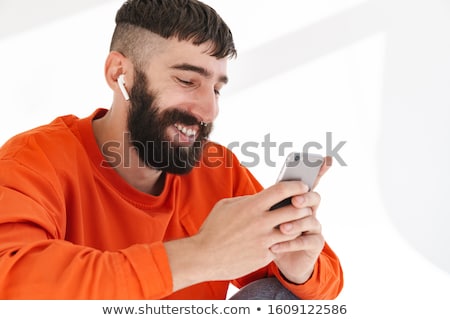 Stock fotó: Image Of Young Bearded Man With Nose Jewelry Wearing Orange Shir