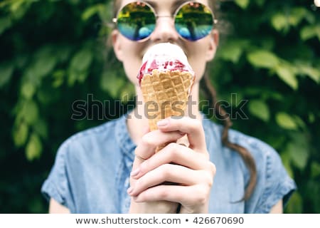 Foto stock: Portrait Of An Young Beautiful Woman Eating An Ice Cream In Cafe