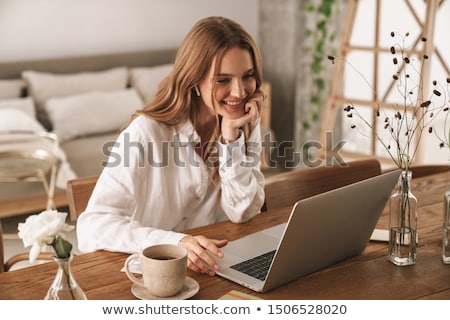 ストックフォト: Young Redhead Girl With A Laptop