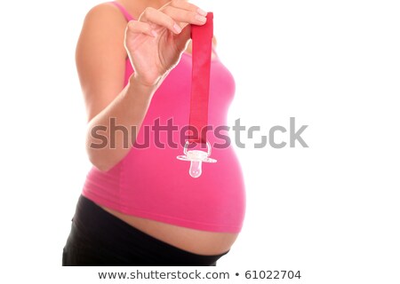 Stock photo: Pregnant Woman Holding Dummy On Ribbon