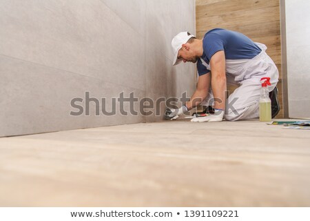 Stock photo: Worker Grouts With Silicone