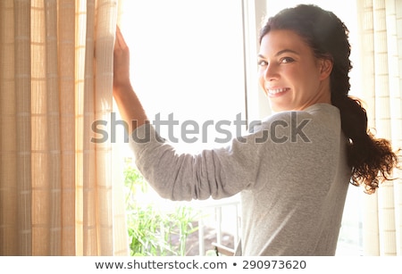 Сток-фото: Contemplative Young Woman Looking At The Camera