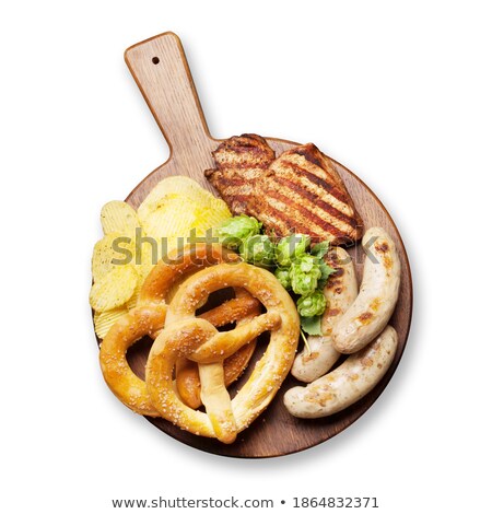 Foto d'archivio: Oktoberfest Set Pretzels Sausages And Chips