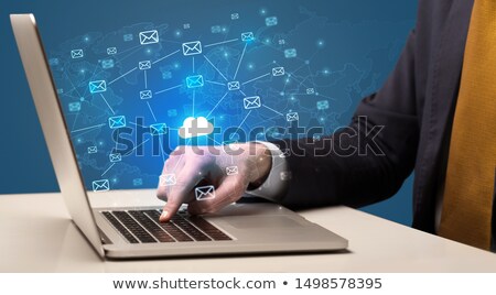 Zdjęcia stock: Hand Sending A Bunch Of Messages On Laptop Concept