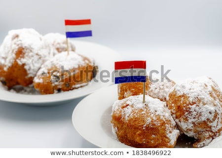 Сток-фото: Pile Of Dutch Oliebollen And Christmas Balls