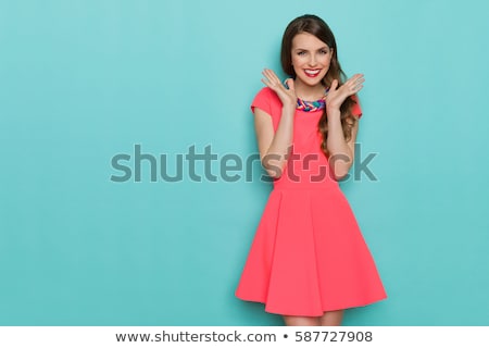 Stock photo: Elegant Woman In Fashionable Dress Posing In The Studio