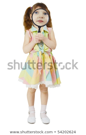 Little Girl Looks At You Through Large Magnifying Glass Stockfoto © pzAxe