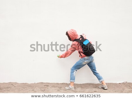 Stock fotó: Graffiti Artist Paint Spraying The Wall