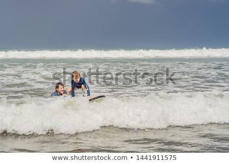 Stock fotó: Father Or Instructor Teaching His 5 Year Old Son How To Surf In The Sea On Vacation Or Holiday Trav