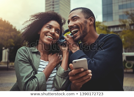 Foto d'archivio: Couple Listening To Music Together