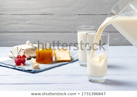 Foto stock: Milk Is Poured Into The Glass