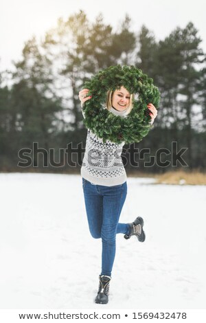 Foto d'archivio: Attractive Smiling Woman With Wreath Over Gray Background