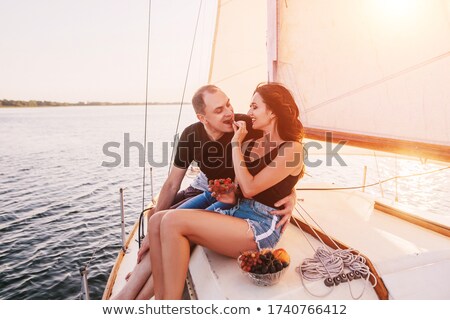 Stock fotó: Couple On A Yacht Enjoy Bright Sunny Day On Vacation