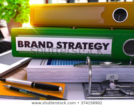 Foto stock: Green Ring Binder With Inscription Brand Strategy