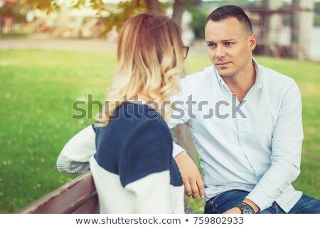 Foto stock: Smiling Couple Talking Outdoors