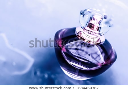 Foto stock: Perfume Bottle Under Purple Water Fresh Sea Coastal Scent As Gl