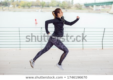 Zdjęcia stock: Healthy Young Woman Running On The Riverside Promenade