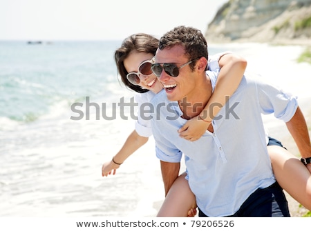 Foto d'archivio: Happy Young Couple Enjoying Summer On Beach