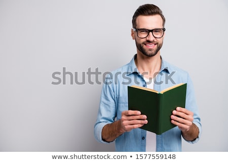[[stock_photo]]: Business Man Reads Interesting Book