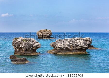 ストックフォト: Three Separate Rocks Offshore In Sea