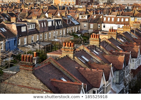 Stockfoto: Old Window On The Top Of The Tenement House