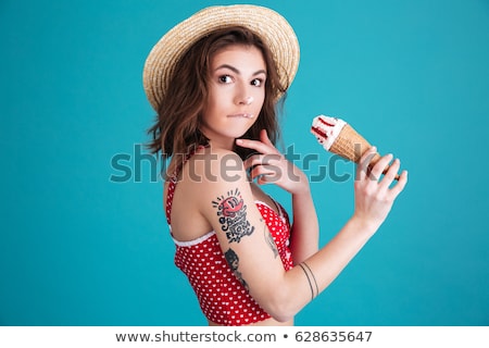 Foto stock: Delighted Young Girl In Summer Hat And Swimwear Resting