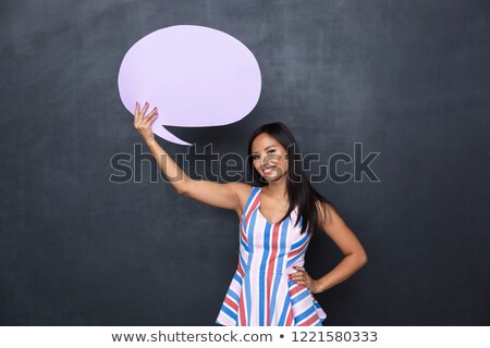 Foto stock: Image Of Pleased Asian Woman 30s Holding Blank Thought Bubble Ab