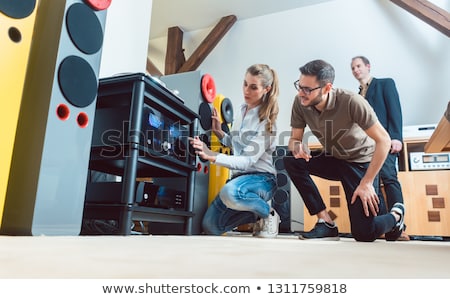 Foto stock: Young Couple Buying High End Stereo Equipment In Store