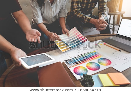 Foto stock: Creative Team Meeting To Discuss The Terms Of Use Of Original Pr