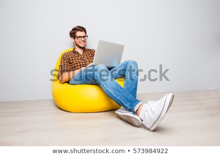 [[stock_photo]]: Young Man Sitting On The Floor And Work With Laptop Computer