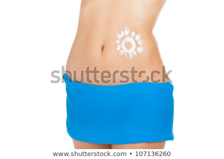 Stock photo: Sunscreen Lotion Over Tan Woman Belly Skin Made As Sun Shape Girl Wear Black Swimsuit Isolated Ove