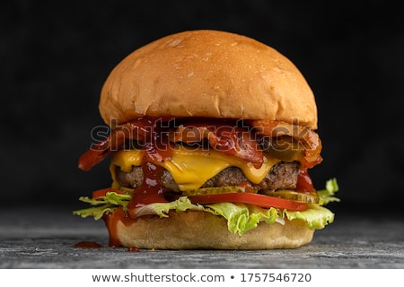 Foto d'archivio: Delicious Egg And Bacon Cheeseburger