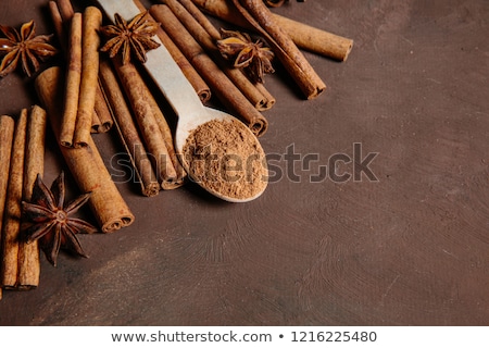 Stok fotoğraf: Cinnamon Sticks With Pure Cane Brown Sugar On Wood Background