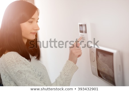 Foto stock: Person Pressing Security System Door Sensor