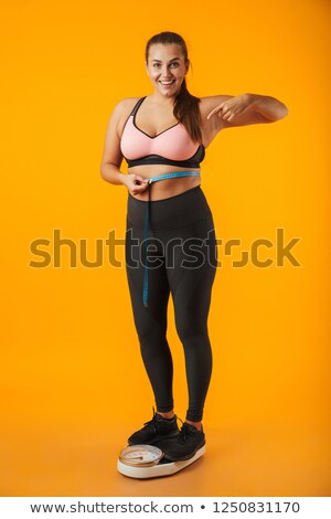 ストックフォト: Full Length Portrait Of A Satisfied Overweight Young Woman