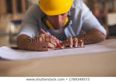 Stockfoto: Carpenters With Ruler And Blueprint At Workshop