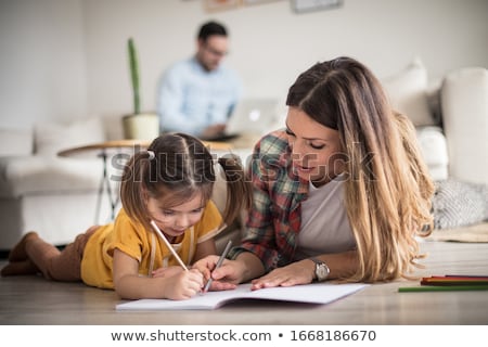 Foto d'archivio: Happy Father Helping Her Daughter For Homework
