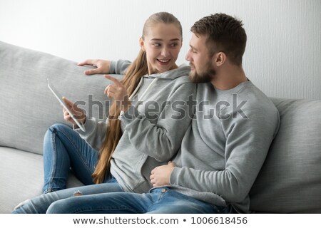 Zdjęcia stock: Man Using Digital Tablet For Donation