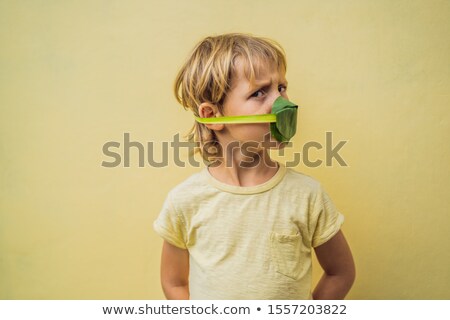 Zdjęcia stock: The Child Made Himself A Face Mask From The Leaves To Protect Himself From Air Pollution Air Purifi