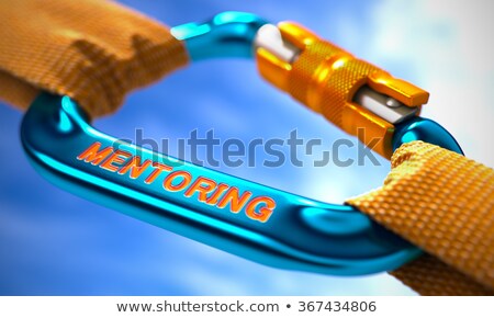 Stockfoto: Mentoring On Blue Carabiner Between Orange Ropes