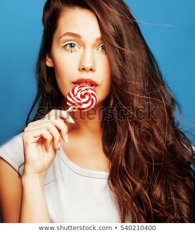 Foto d'archivio: Young Pretty Adorable Woman With Candy Close Up Like Doll