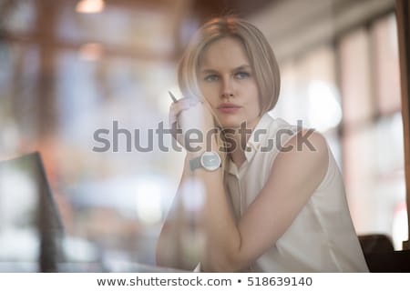 Foto d'archivio: Young Seated Blonde Casual Woman