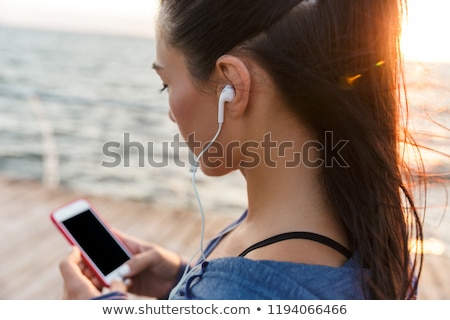 Stock fotó: Beautiful Adult Caucasian Woman Using Mobile Phone On Seaside Va